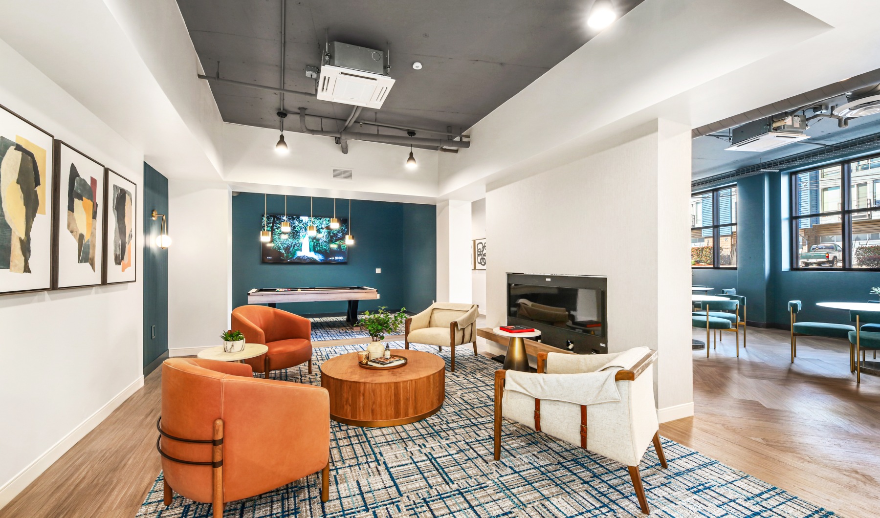 The best of city living Fireplace lounge with pool table and TV