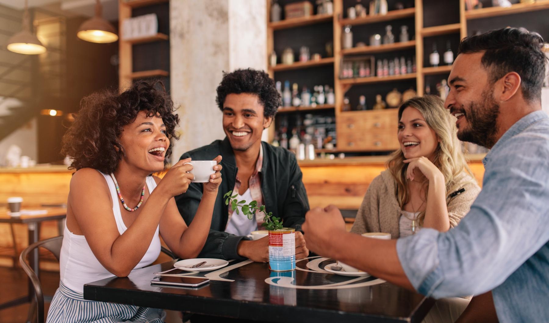 Bustling community with plenty of dining choices a group of people sitting at a table